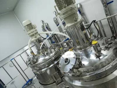 steel chromed tank with pressure meter and engine in clean laboratory, turned